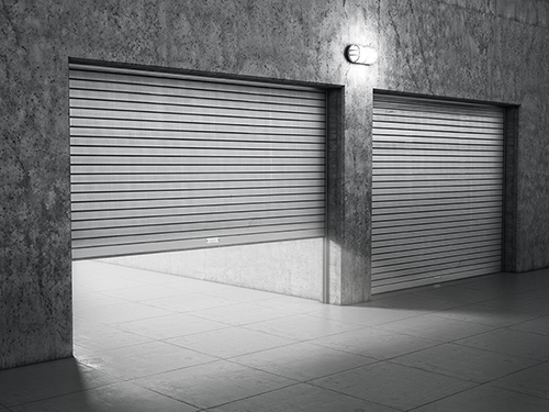 Garage building made of concrete with roller shutter doors